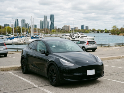 Port Credit waterfront parking lot with damaged windshield on parked vehicle